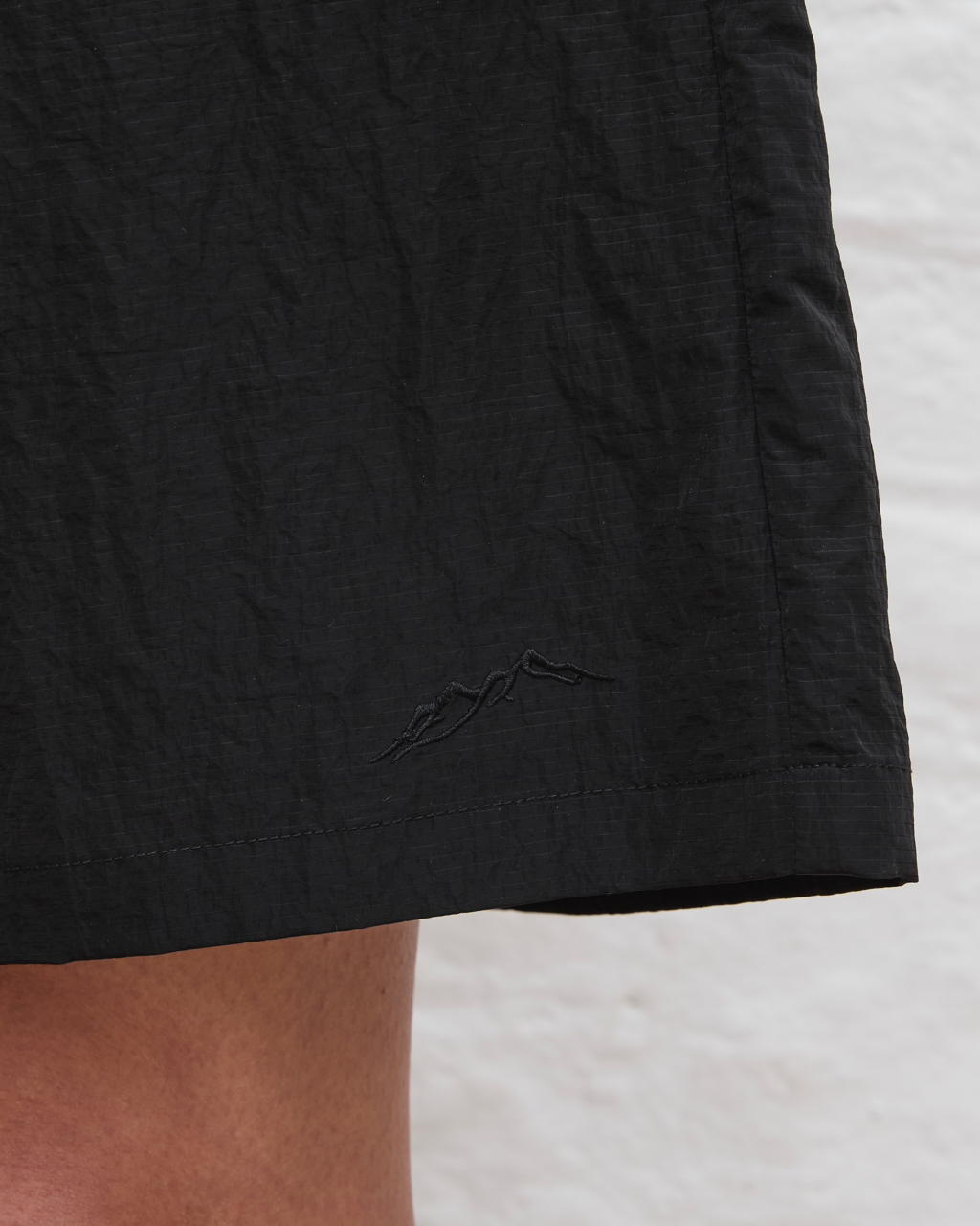 Close-up of a black shorts on a light background