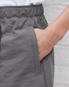 Gray shorts worn by a person with a neutral background